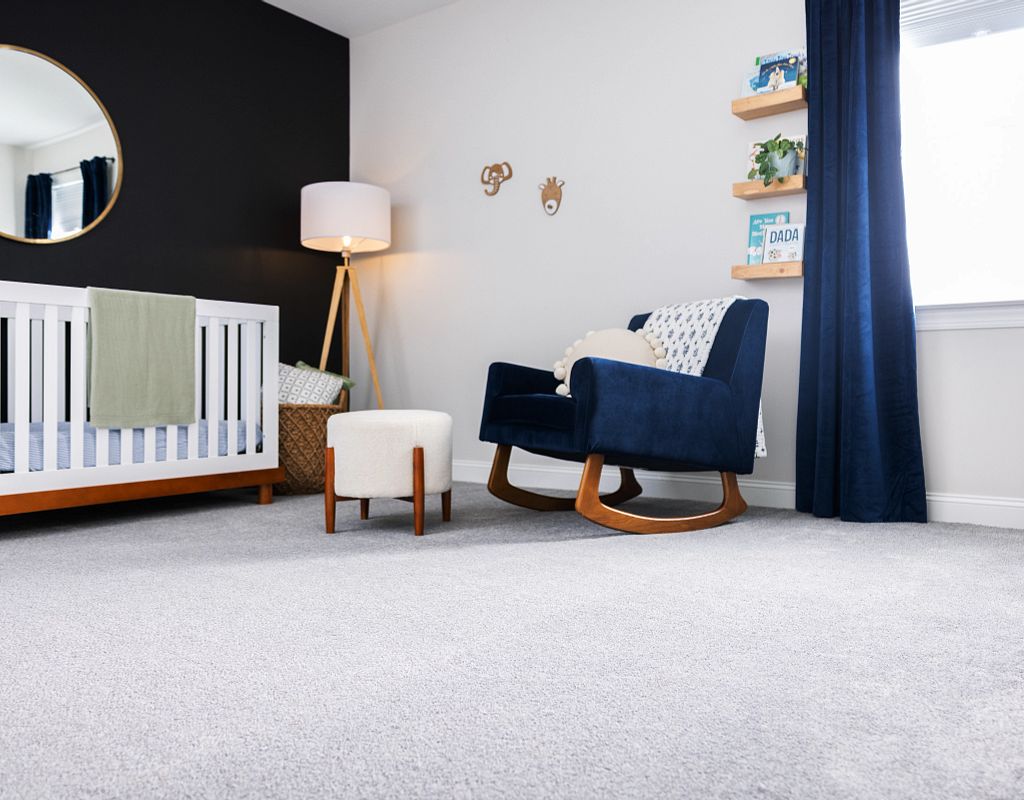 Blue chair on carpet | Nemeth Family Interiors
